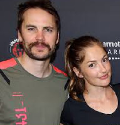 Minka Kelly and Taylor Kitsch posed together.